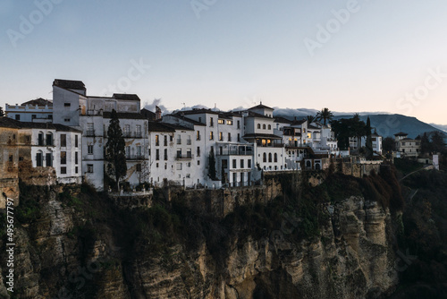 Skyline of the white buildings of Ronda Old town next to the cliff.