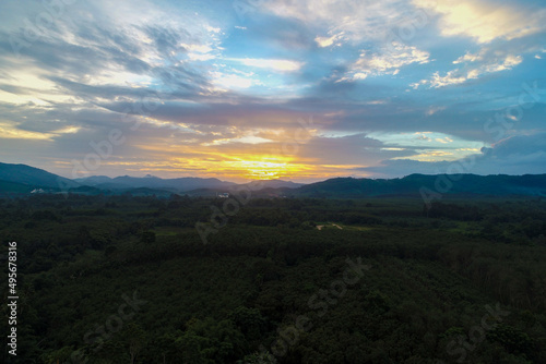 Aerial view mountain sunrise in tropical forest with cloud © themorningglory
