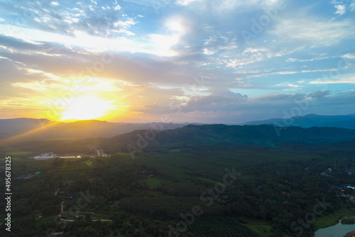 Aerial view mountain sunrise in tropical forest with cloud