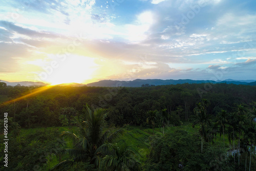 Aerial view mountain sunrise in tropical forest with cloud