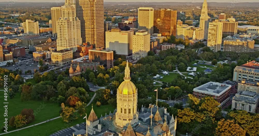 Hartford Connecticut Aerial v16 birds eye view overlooking at golden sunset reflection on state capitol building and downtown high rise cityscape - Shot with Inspire 2, X7 camera - October 2021