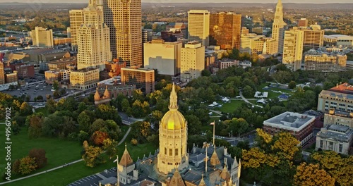 Hartford Connecticut Aerial v16 birds eye view overlooking at golden sunset reflection on state capitol building and downtown high rise cityscape - Shot with Inspire 2, X7 camera - October 2021 photo