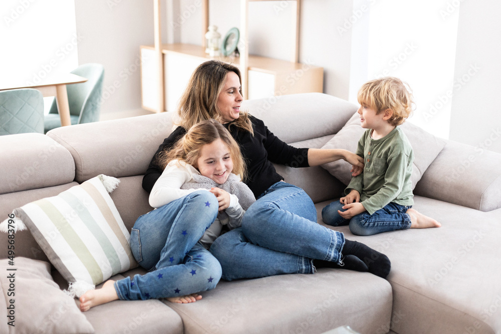 Mother with kids on couch Mother with kids on couch