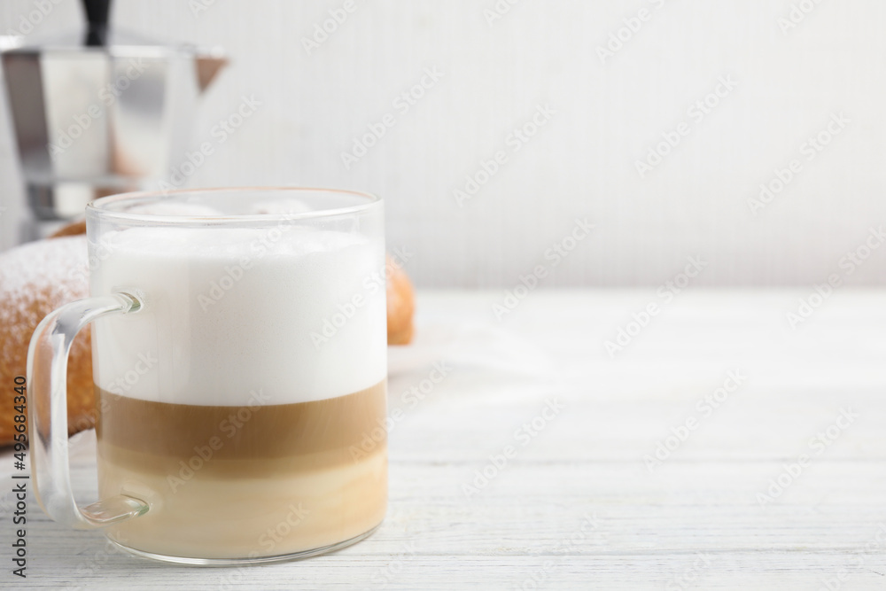 Delicious latte macchiato and croissant on white wooden table. Space for text Delicious latte macchiato and croissant on white wooden table. Space for text