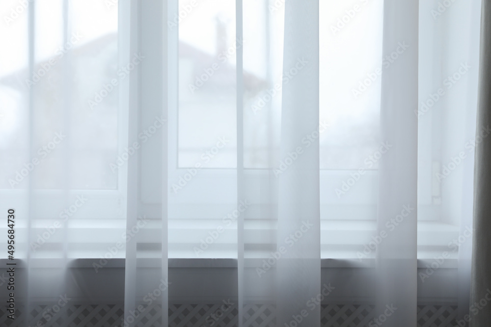 Window with beautiful elegant curtains in room Window with beautiful elegant curtains in room