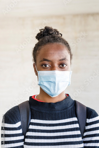 Black woman in protective mask photo