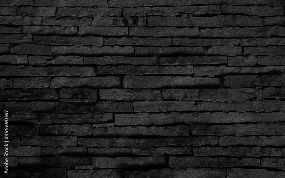 black brick wall background, dark stone texture.  