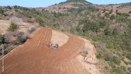 Tractor plowing the field.