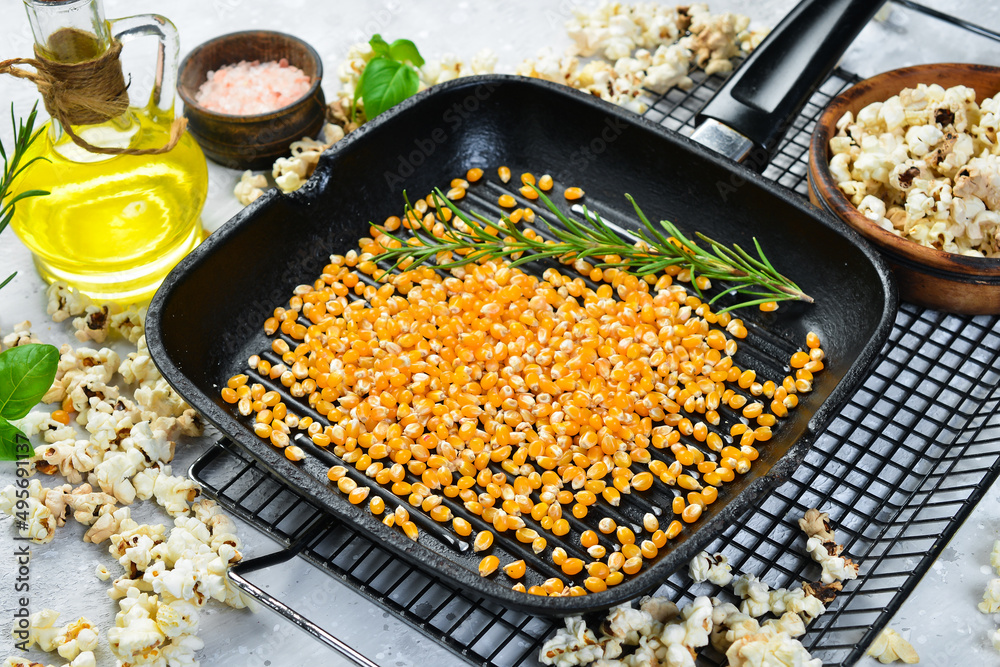 Dried corn for popcorn in a metal pan. Top view. Rustic style. Dried corn for popcorn in a metal pan. Top view. Rustic style.