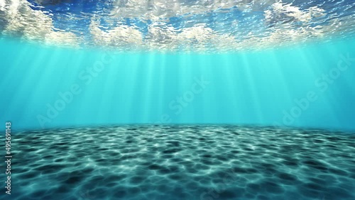 Animation of walking and moving on the seabed with rays of sunlight shining from above penetrate deep clear blue water. Caustic effect on the seabed. Sunlight radiates underwater