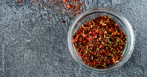 Spices for meat in a glass bowl. Special marinade for meat from red hot pepper, bell pepper, black pepper