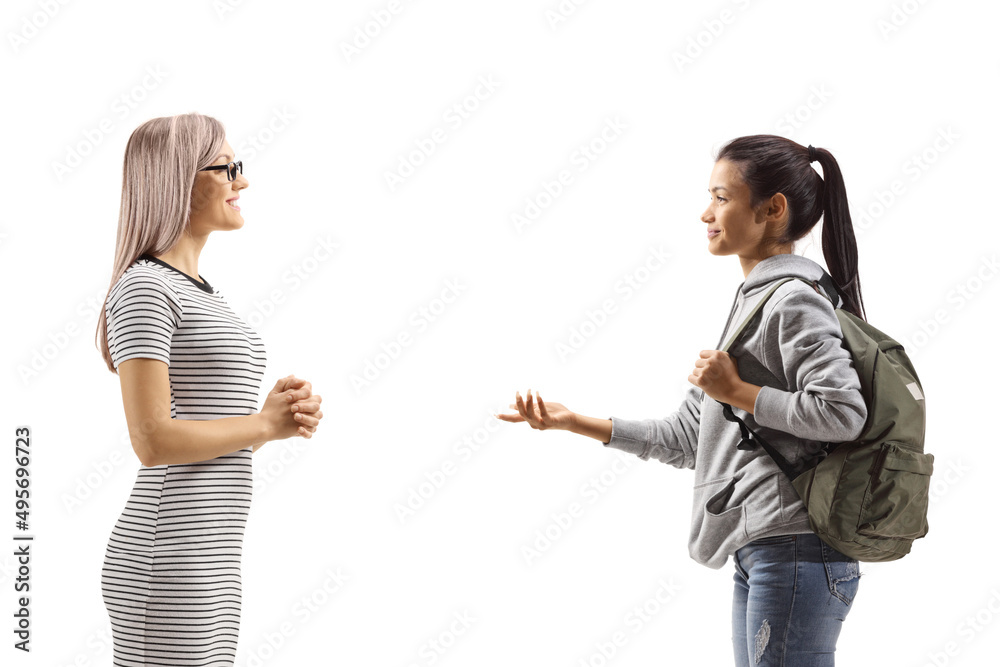 Female student talking to a young blond woman Female student talking to a young blond woman