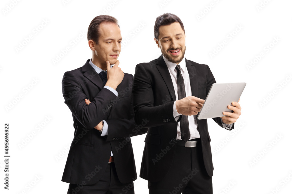 Two professional men looking at a digital tablet Two professional men looking at a digital tablet