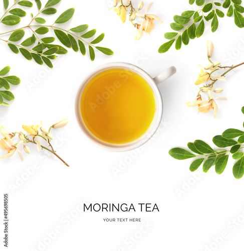 Creative layout made of moringa tea on the white background. Flat lay. Food concept. Macro  concept. photo