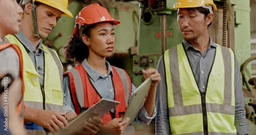 Engineering team Electrical technicians and inspectors Multi ethnic hold meeting to inspect machinery equipment within a large industrial plant. Professional Operation. working workshop training