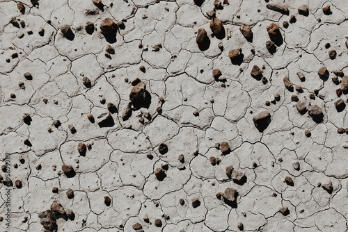 Top view of the clacked stone ground with pebbles photo