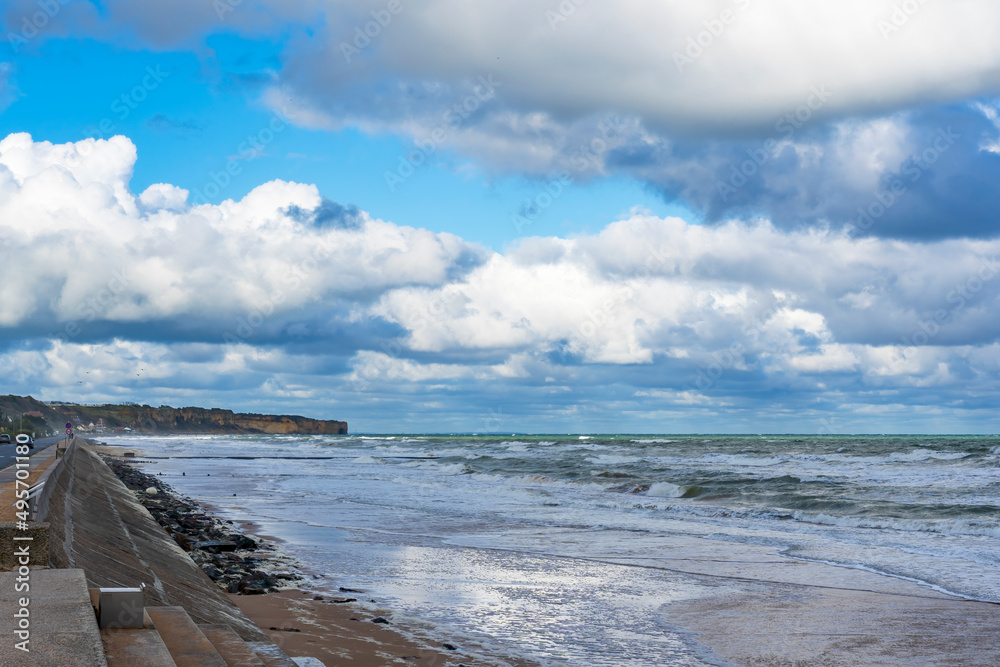 Beautiful cloudy skies over the landing beaches of Omaha Beach near the village of Vierville-sur-mer in Normandy, France Beautiful cloudy skies over the landing beaches of Omaha Beach near the village of Vierville-sur-mer in Normandy, France