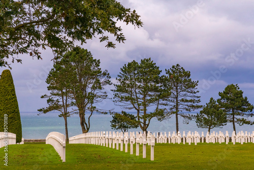 Endless rows of white crosses towards the sea at the impressive American military cemetery near Colleville-sur-Mer in Normandy, France photo