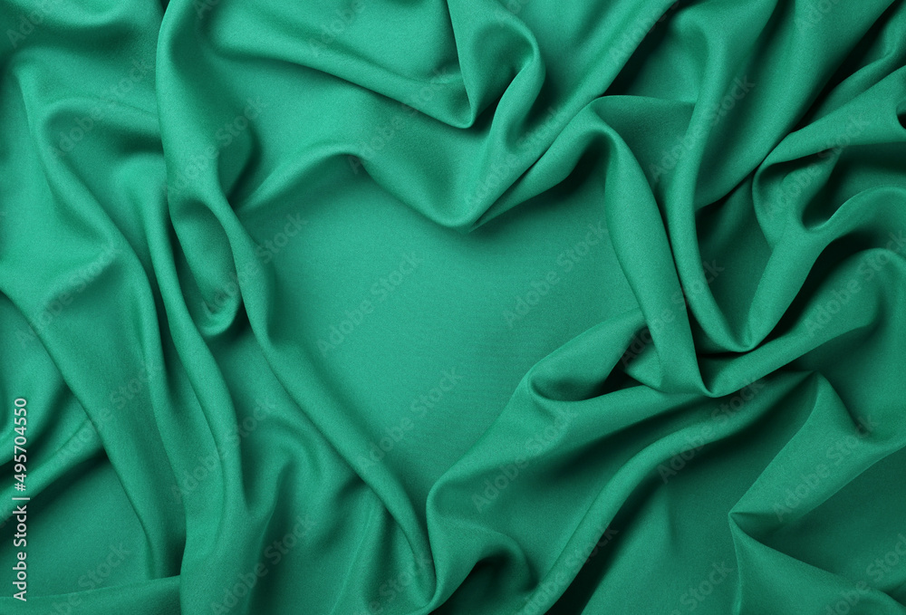 Fototapeta premium Teal heart shape textile fold pleats background