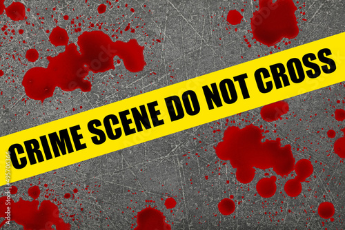 Yellow police barricade tape over blood stains
