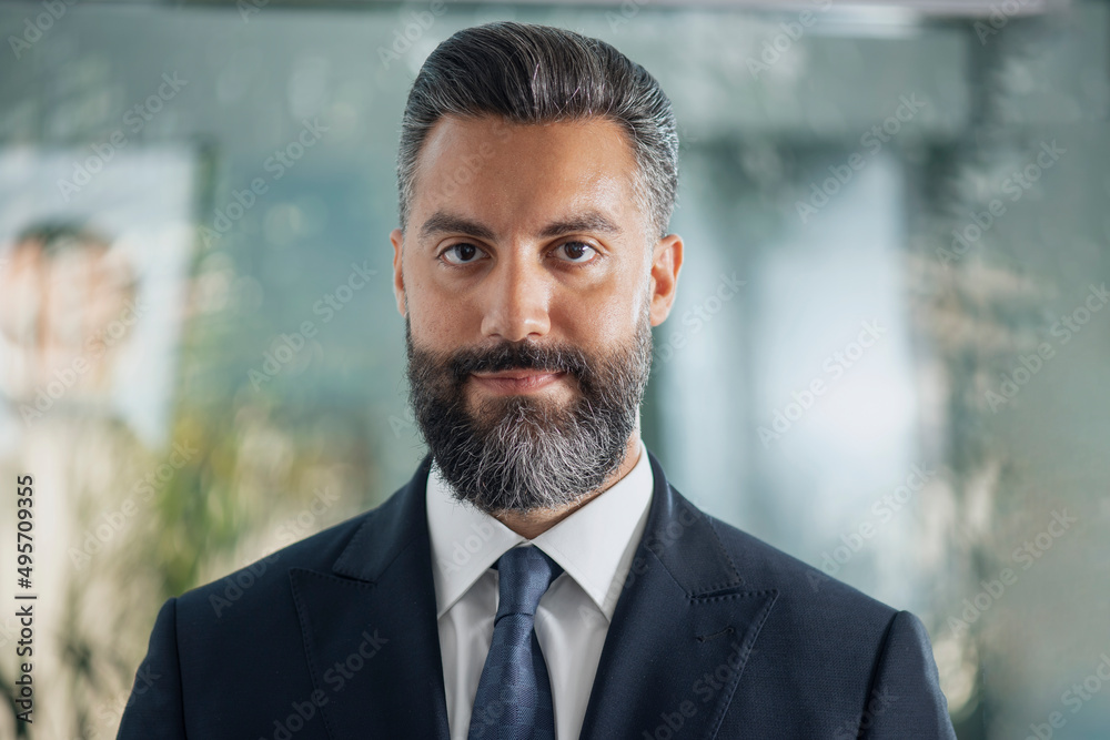 Fototapeta premium happy young businessman posing in a modern office