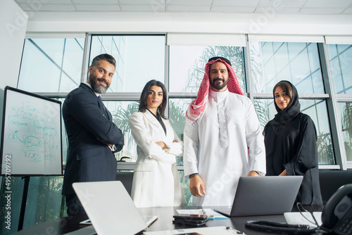 Multiethnic corporate business team meeting in the office for a strategic marketing plan - Office workers, entrepreneurs, and company employees at work in a multinational company photo