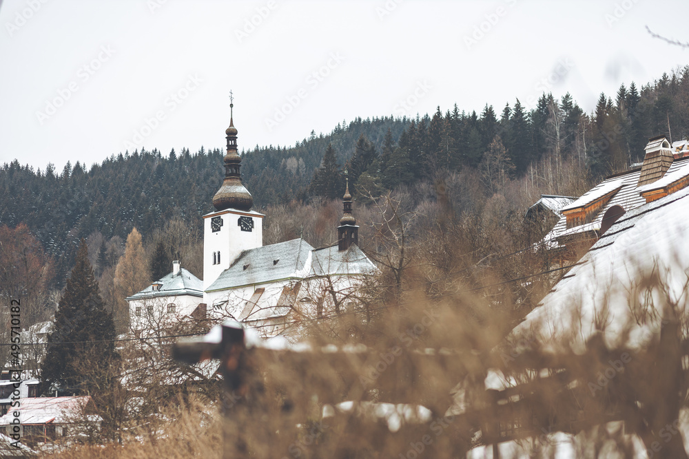 Beautiful shot of a church in Spania Dolina, Slovakia in winter - obrazy, fototapety, plakaty 