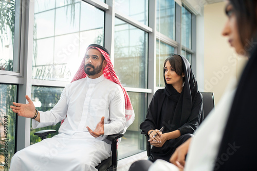 Multiethnic corporate business team meeting in the office for a strategic marketing plan - Office workers, entrepreneurs, and company employees at work in a multinational company
