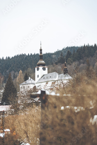 Vertical shot of a church in Spania Dolina, Slovakia in winter