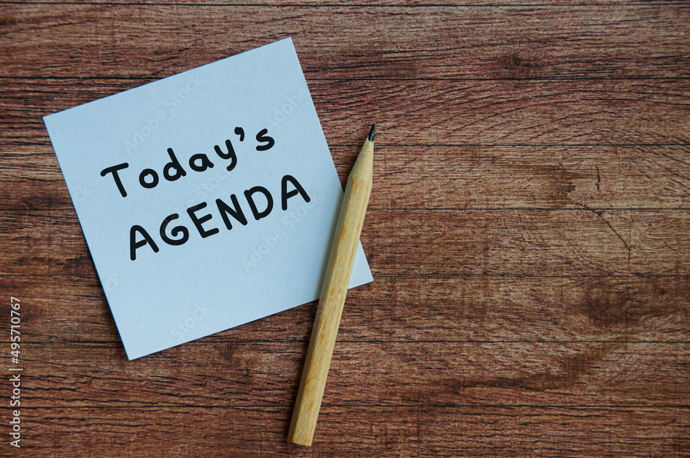 Today's agenda on white notepad with wooden table background. Stock Photo |  Adobe Stock