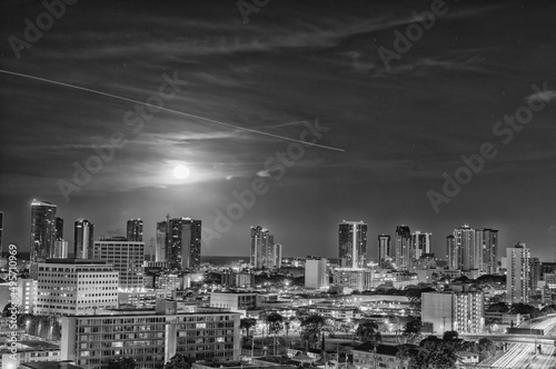 Full Moon above a Cityscape in Black and White.
