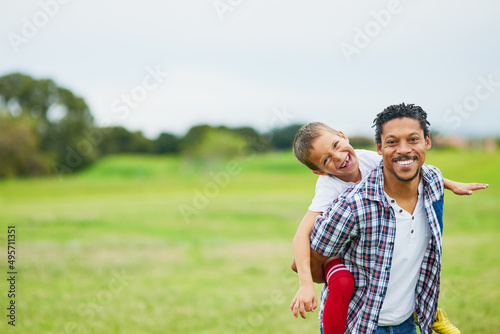 Always a good day with dad. Portrait of a father and son enjoying a day outside together. © Koegelenberg/peopleimages.com