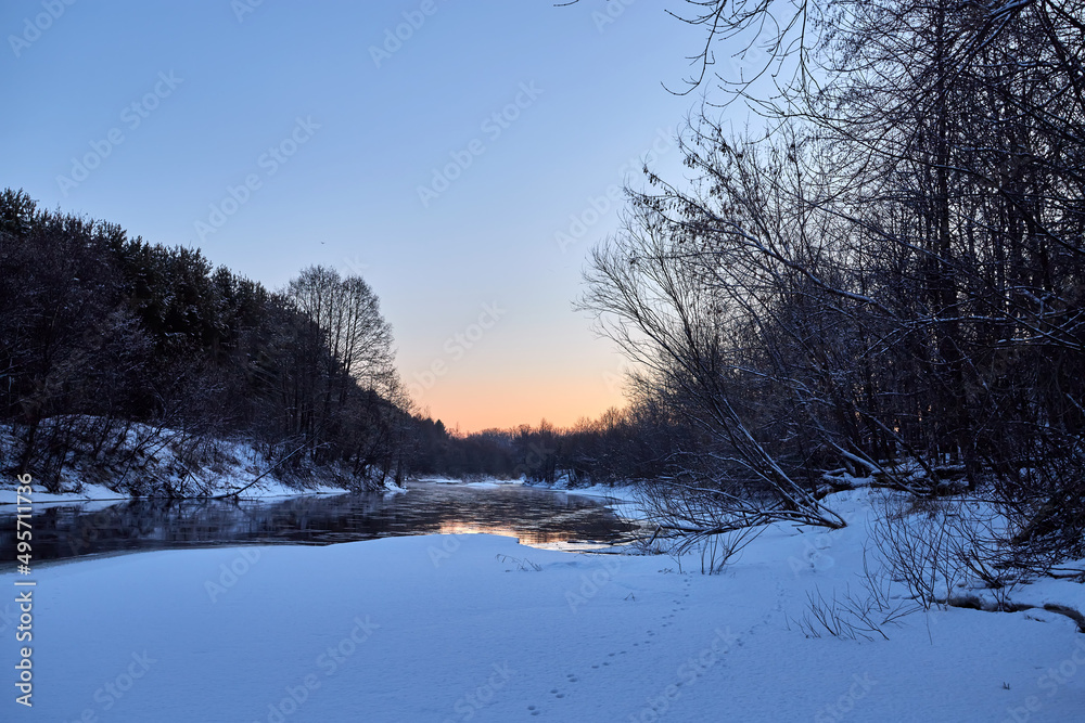 Ice drift on the river on a spring day in the forest near birch trees. Concept of spring floods. Ice drift on the river on a spring day in the forest near birch trees. Concept of spring floods.