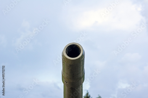 Tank gun barrel. Military background.