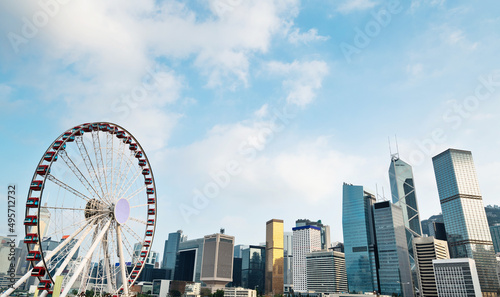 Photography Ferris wheel and office buildings in Hong Kong