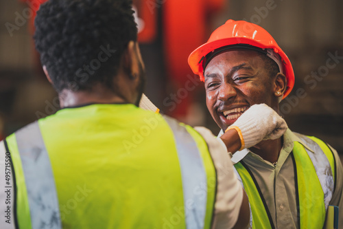 Obraz na płótnie Teamwork African American worker in the factory.Black man afro work heavy industrial w salonie