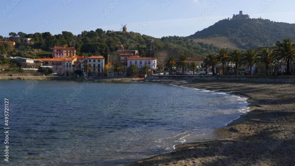 Collioure view from the beach with the Mill on the top of the village Collioure view from the beach with the Mill on the top of the village