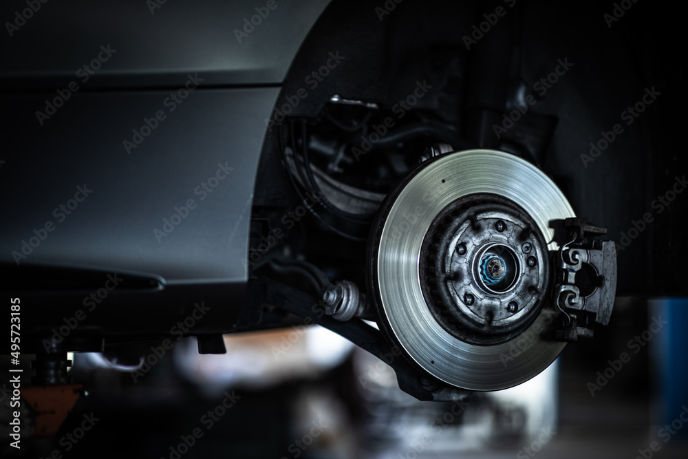 Tyre change - wheel balancing or repair and change car tire at auto service garage or workshop by mechanic Tyre change - wheel balancing or repair and change car tire at auto service garage or workshop by mechanic