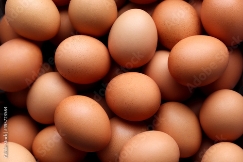 Close-up of many chicken red eggs background.