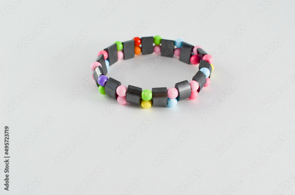 a children's bracelet. wooden multicolored bracelet. a children's bracelet. wooden multicolored bracelet.