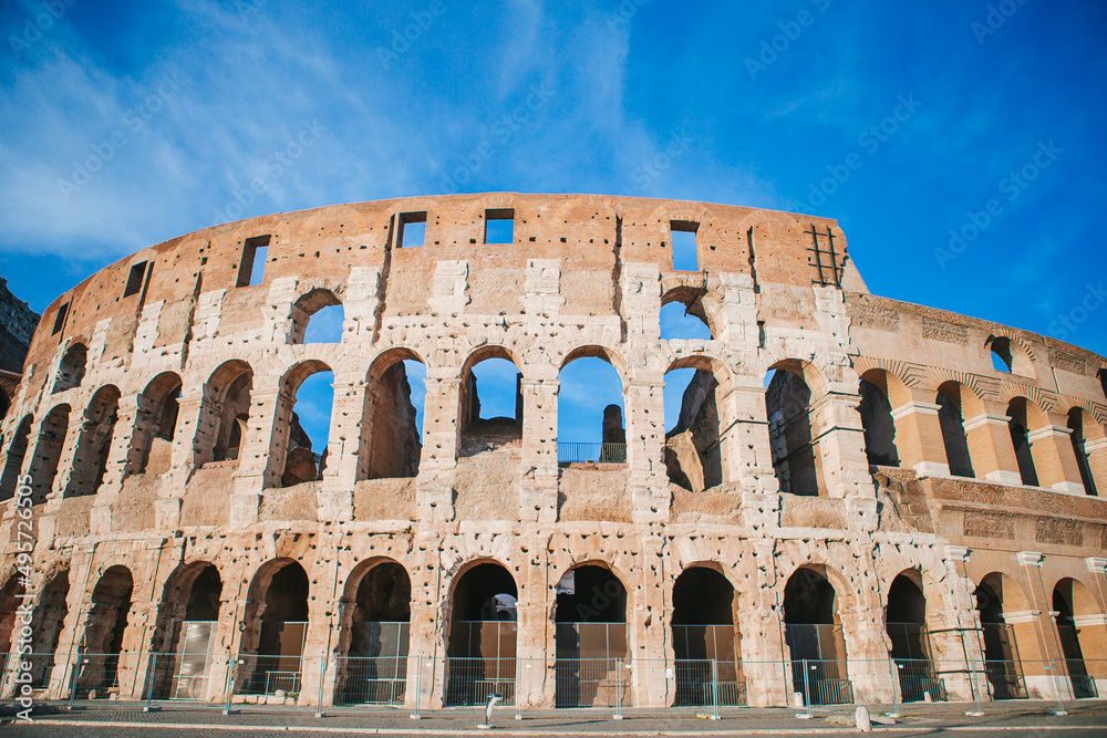 Colosseum background blue sky in Rome, Italy