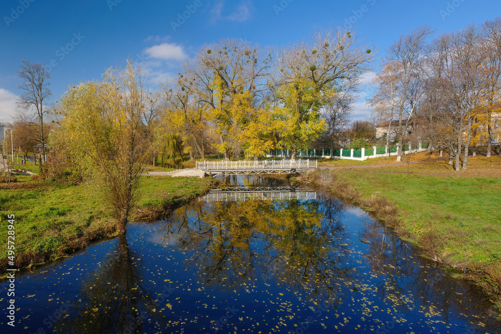 Autumn scenery of public park and Okhtyrka river in Okhtyrka, Ukraine