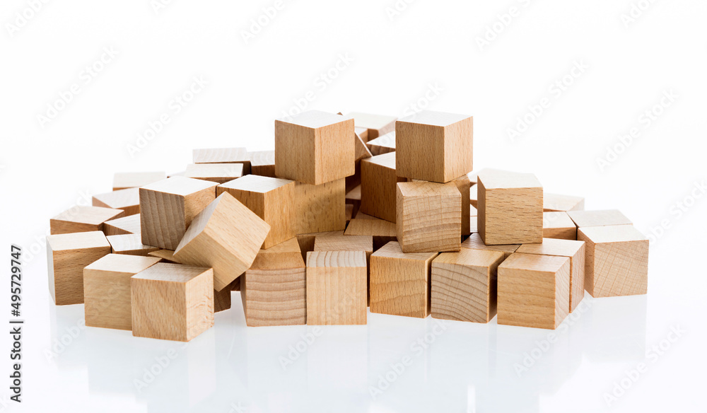 Fototapeta premium Stacks of wood blocks on white background