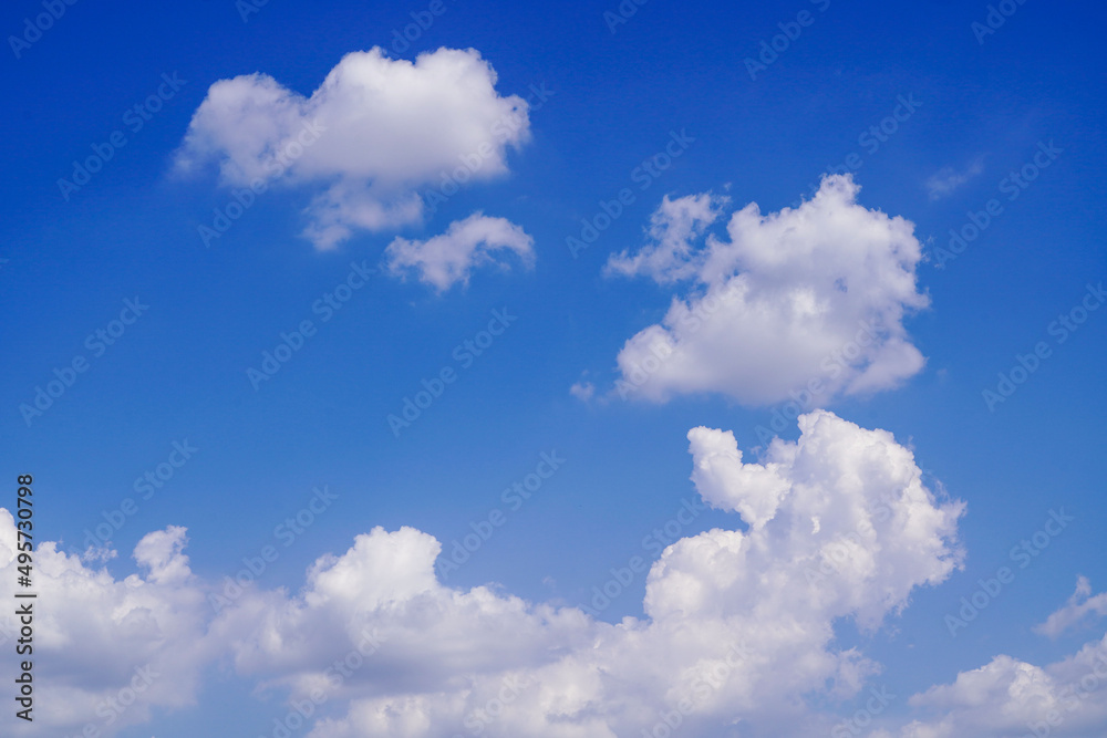 Blue sky with white clouds. Sky and clouds during the daytime in the summer. white fluffy clouds in the blue sky.