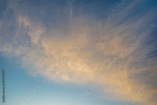 Majestic clouds burning by sunset. Sky background