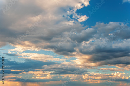 Majestic clouds burning by sunset. Sky background