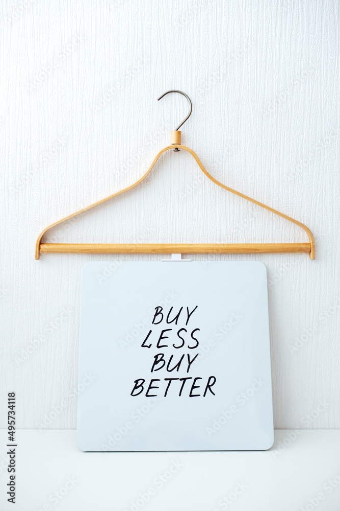 Sustainable consumption and production. Circular economy, Sustainable  fashion concept with wooden clothes hangers and text Buy less, buy better  Stock-Foto | Adobe Stock