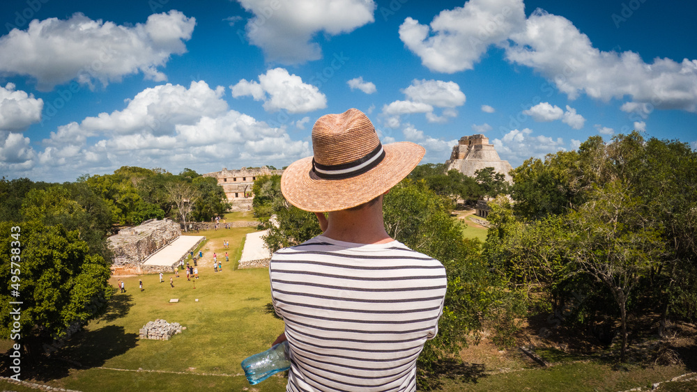 Man looking at Mayan ruins in Mexico
