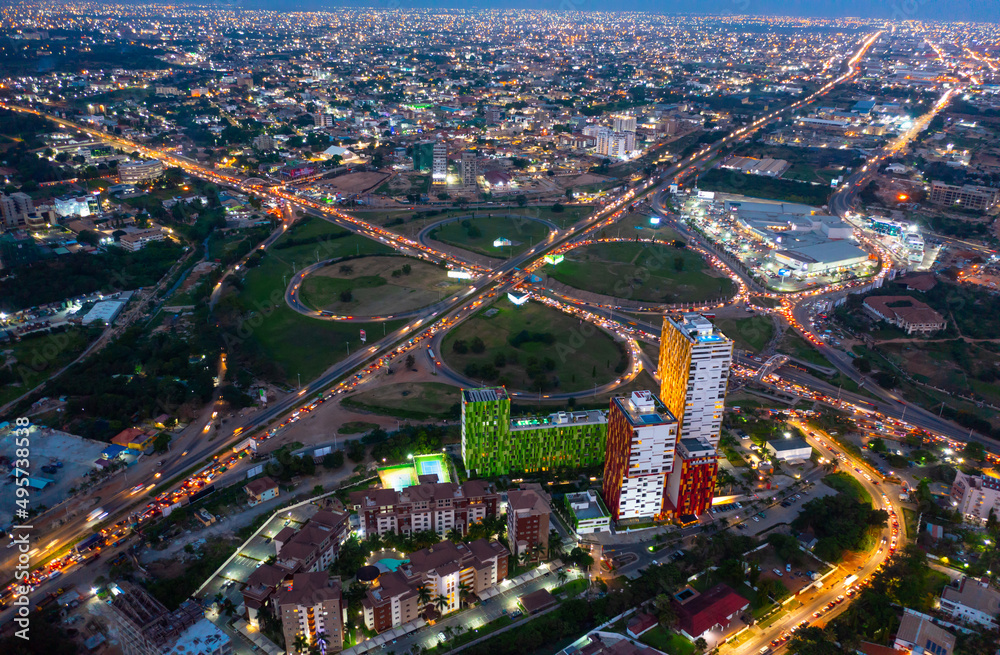 Aerial shot of the city of Accra in Ghana at night - obrazy, fototapety, plakaty 