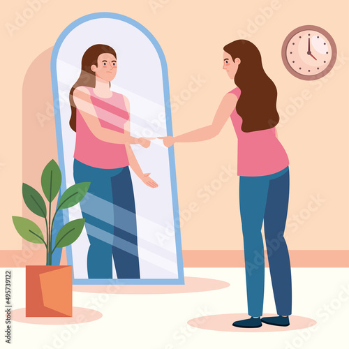 young woman looking fat in mirror